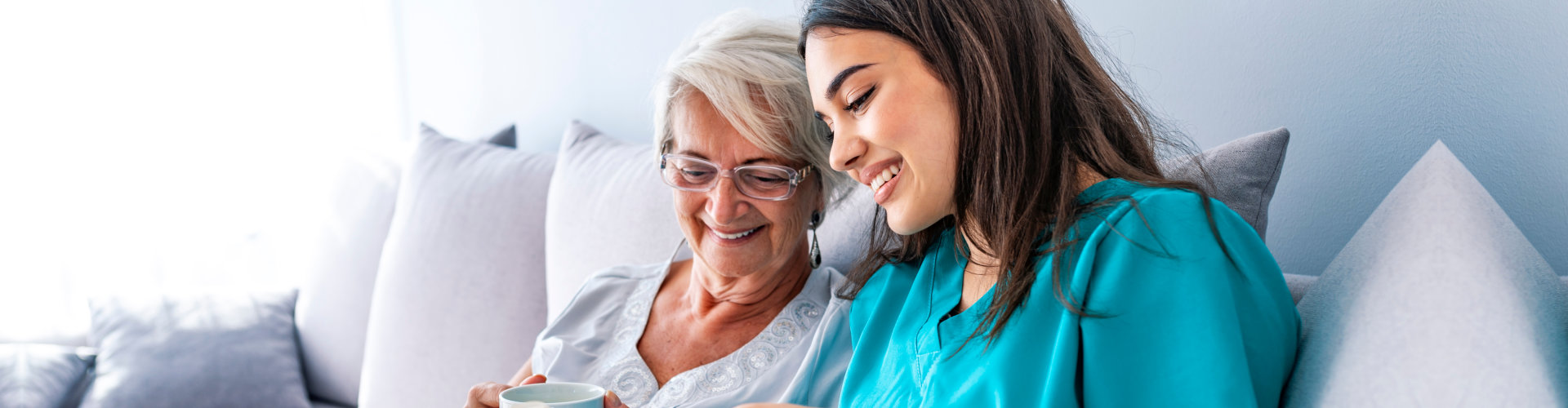 nurse and elderly woman smiling