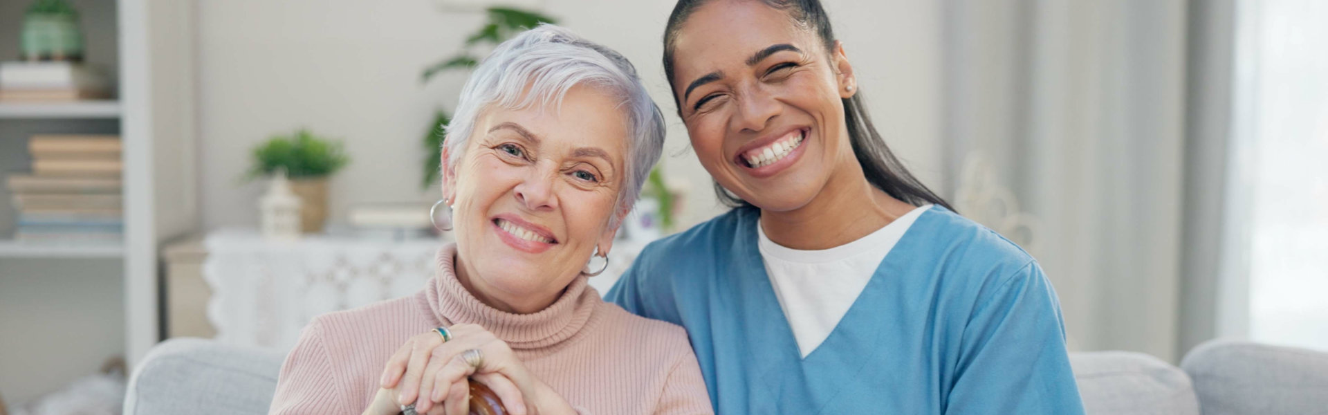 caregiver and senior woman smiling