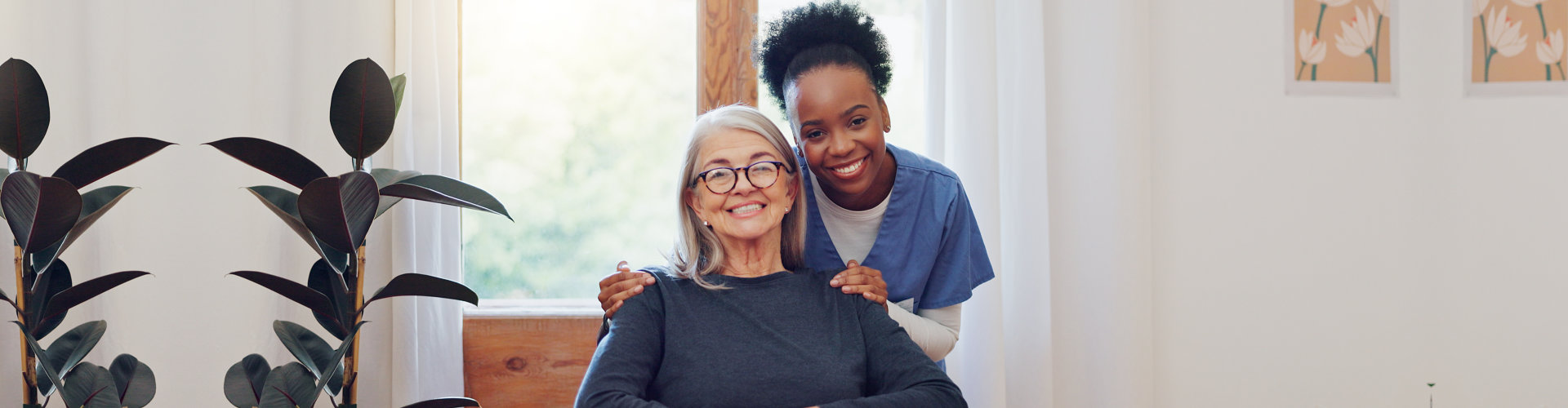 Nurse and woman with wheelchair, portrait and smile in health at nursing home.